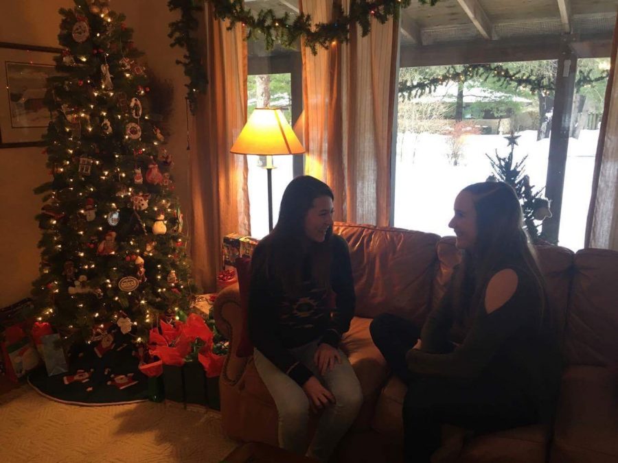 Freshmen Chloe Renzelmann and Emily Edson laugh and talk over Winter Break. The two are cousins, so their families get together to celebrate over Break.