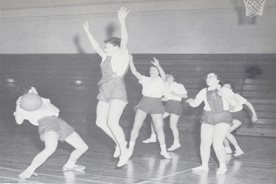 FIGHT TO THE BITTER END-South High School students play basketball after school. These ladies played through the GAA, as South did not offer sports for girls at that time (1961 Lake Breeze yearbook).