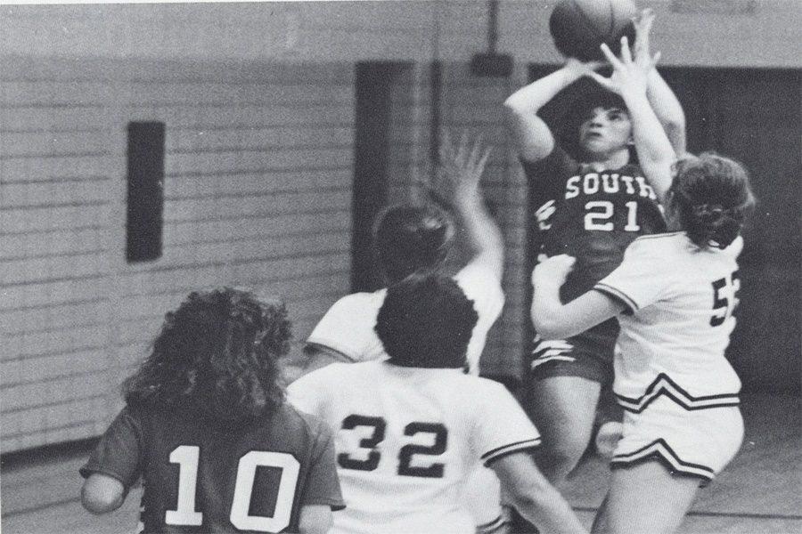 HOOPS-Two South High Redmen play basketball in the now-called Redwing Gym. As the Acuity Fieldhouse did not exist, all basketball games took place there, with the exception of the North-South game (1986 Lake Breeze yearbook).