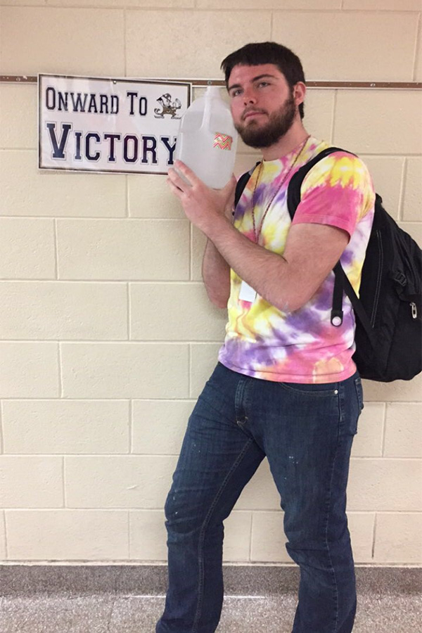 Senior Evan Horen is pictured with his trusty gallon of water that he drinks daily. One way to assist with healthy living is to drink a lot of water.