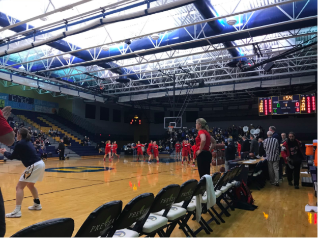 The girls prepare for the first varsity game of the night. The tensions rise as each team begin.