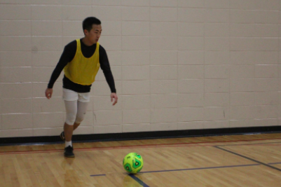 Steven Yang prepares to take the corner so that it may set up one of his teammates to score.